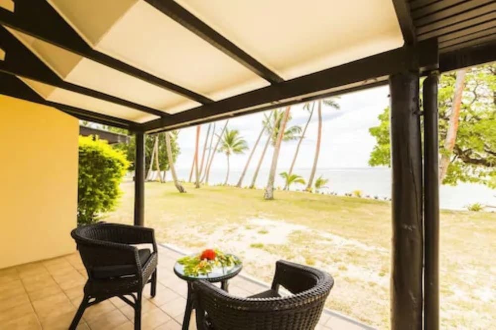 Beachfront Bure (1 Double and 2 Single Bed) at Tambua Sands Beach Resort - Adults Only