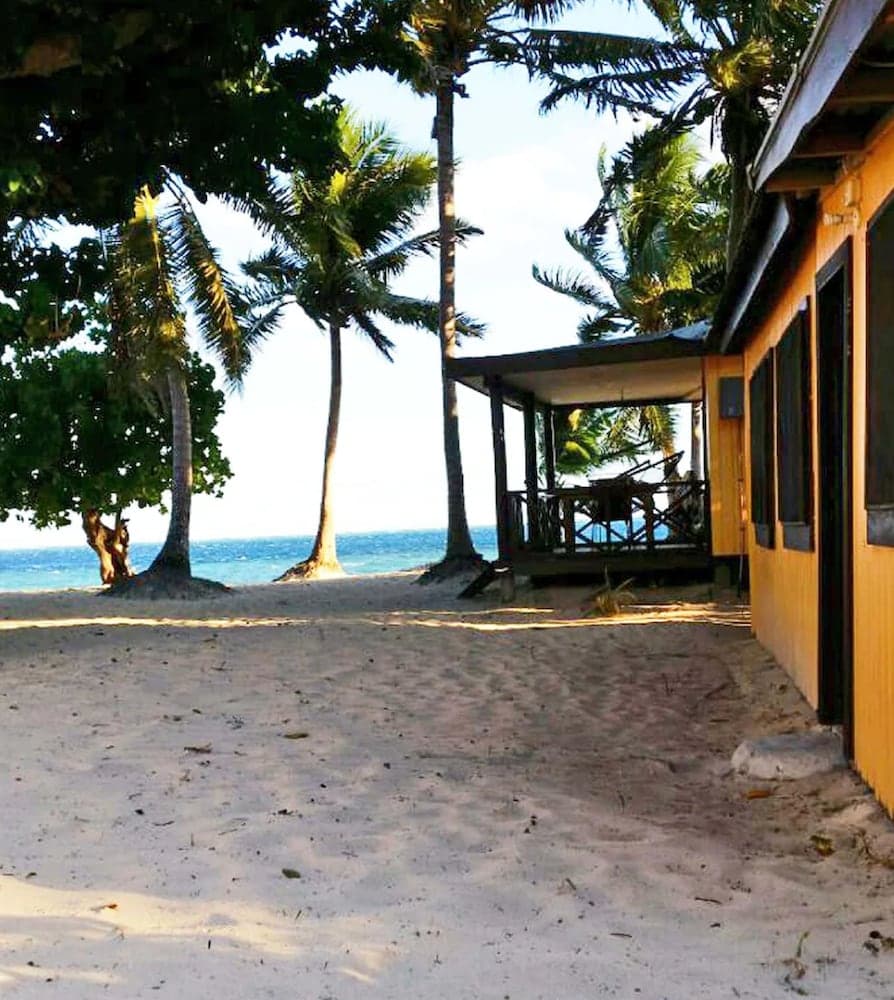 Beach Front Family Room at Ratu Kini Backpackers & Dive Resort