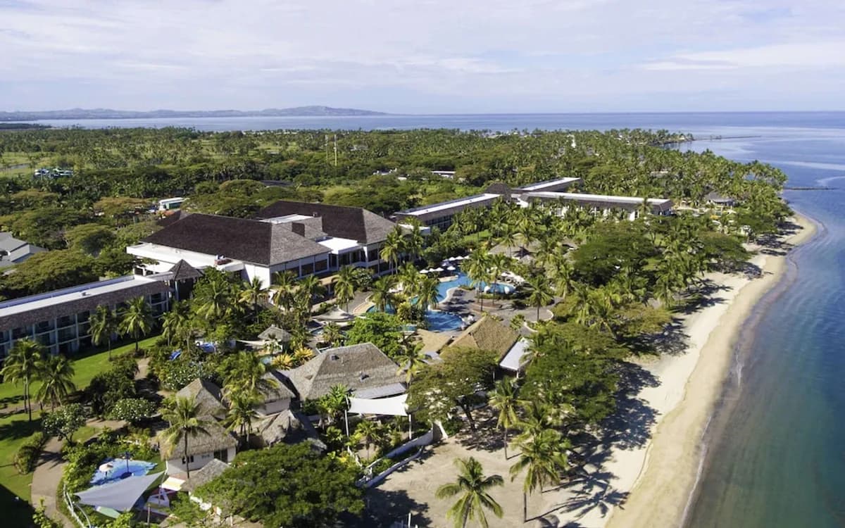 Aerial view of coastal resort grounds and the sea in Fiji
