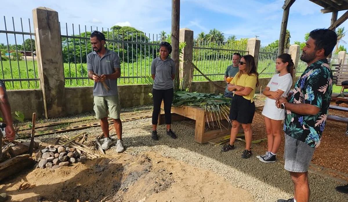 Travellers learning about traditional Fijian lovo cooking
